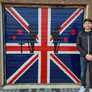 Kyle in front of his Remembrance Sunday garage door.
