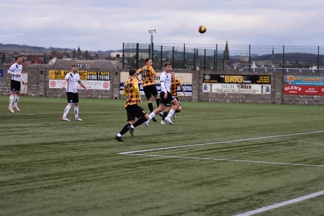 Trouten's excellent header loops over Forfar stopper Marc McCallum and into the back of the net
