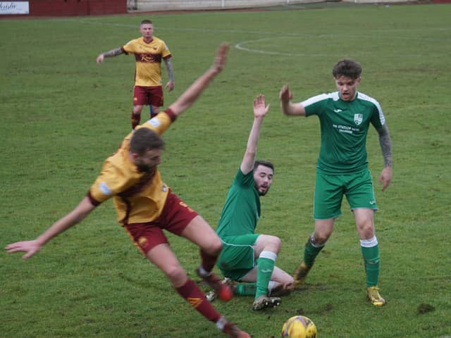 Whitburn scorer Ross Crawford (1st left) and Thornton pair Matthew Robertson and Jamie McNeish all claim for throw-in