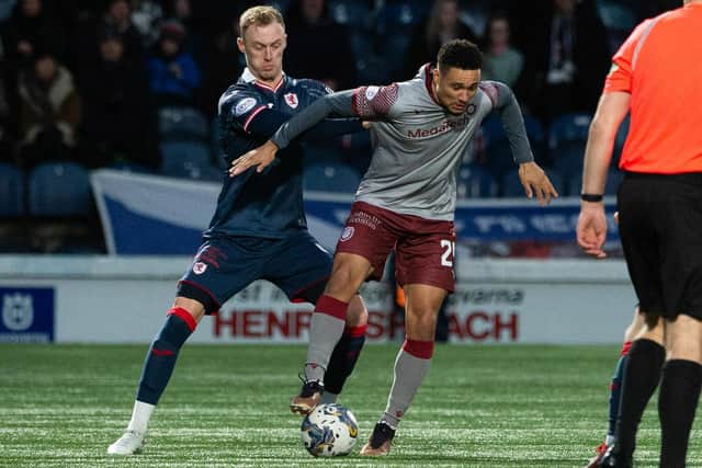 Raith Rovers defender Ross Millen getting to grips with Arbroath's Jermaine Hylton during their teams' two-all draw at Stark's Park in Kirkcaldy on Saturday (Photo by Paul Byars/SNS Group)