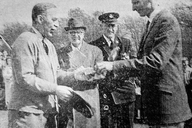 The opening of Dunnikier Golf Course in Kirkcaldy, May 1963: Mr Stutt, course designer, presents Councillor Nicholson with a cigarette casket.