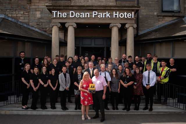 Owners Margaret and Colin Smart and staff at the Dean Park Hotel, Kirkcaldy, celebrate its AA four-star rating.