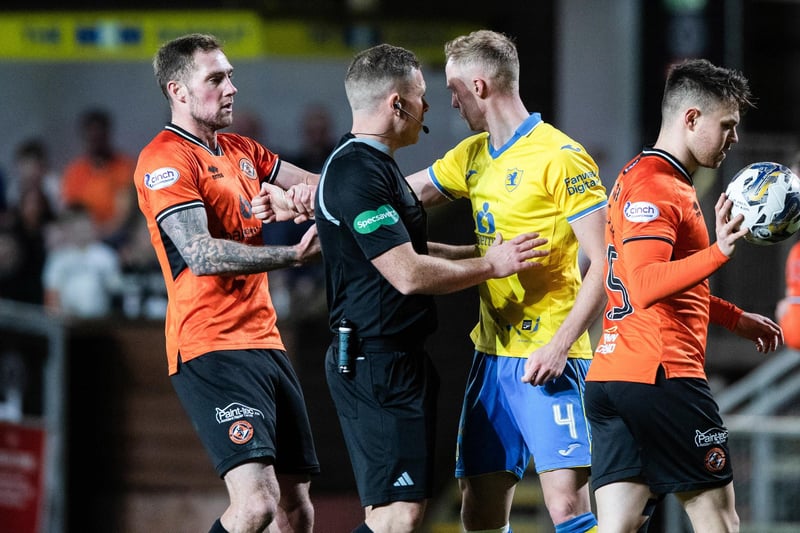 Match referee John Beaton separates Dundee United's Kevin Holt and Raith Rovers ace Ross Millen as tensions boil over