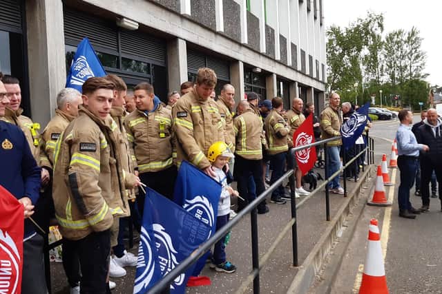 Firefighters demonstrate outside Fife House