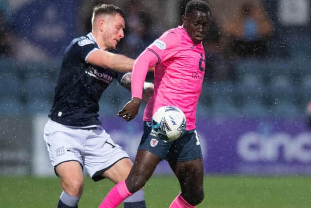 Dundee's Lee Ashcroft and Raith Rovers' William Akio going up against each other on Tuesday (Photo by Mark Scates/SNS Group)