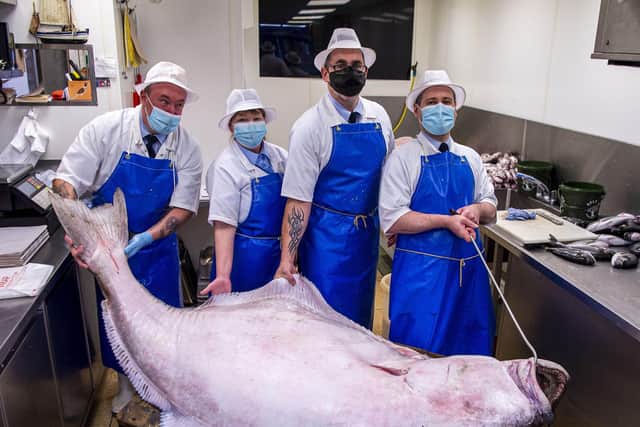 PIC LISA FERGUSON 14/09/2021Gary Huckle, armstrong's fishmonger, stockbridge130kilo halibut caught by the Aquarius off the west coast. Be on display in the shop from Tuesday aml-r GARY HUCKLE, LYN BRYCE, DAVID SHAND, ZOLTAN ANTAL