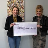 Jenny Gilruth MSP presents a cheque for £210 to centre manager Yvonne Crombie