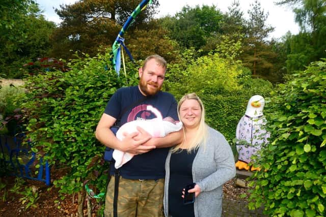 Pictured are Kirkcaldy couple Gemma Munro and Andrew Couper with their baby daughter Georgia in the garden of Rachel House hospice in Kinross.