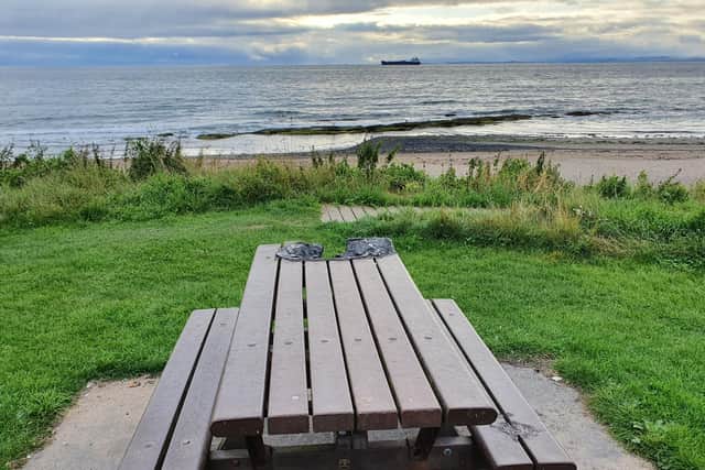 One of the picnic tables at Seafield which has been badly burned, most likely by a disposable barbecue.