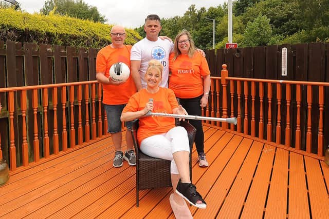 Neighbours Andrew Hain, Kevin Payne, Fiona Hain, and Susan Dobbie (seated) are driving to all senior football grounds in 24 hours for charity. Pic: Fife Photo Agency.