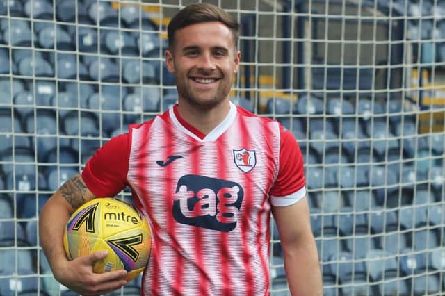 Lewis Vaughan models the Raith Rovers away strip for the new season, which also has red shorts and socks (picture by Raith TV)