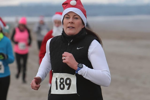 Anster Allsorts' Leanne Reilly was 36th in 28:59 in Anster Haddies' Santa's Sleigh of Fire 5k beach race at St Andrews on Sunday