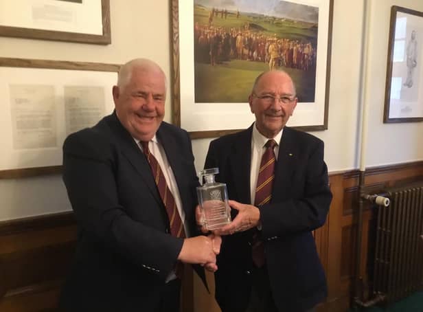 Thistle captain, Alex Miller (left) presenting George with his decanter
