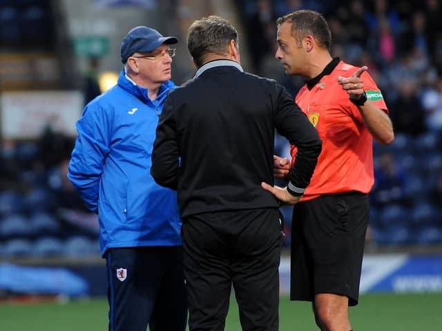 John McGlynn and Dunfermline boss Peter Grant speak with referee Gavin Duncan on Friday night (Pic : Fife Photo Agency)