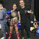 Zia Parke, wearing her Sandee British Championship belt, is pictured with her club coach Kevin Cottrell (Submitted pic)