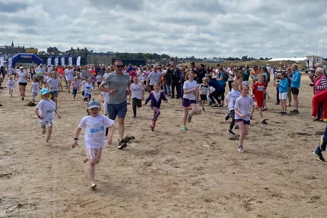 Many children took part in the Chariots Beach Race one-mile fun run, enjoying the opportunity to race along the sand.
