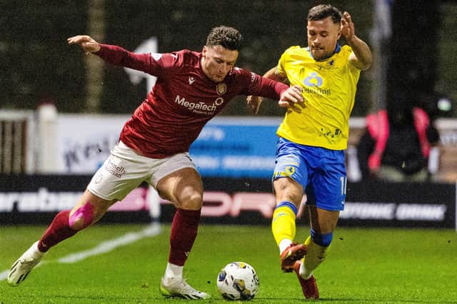 Raith Rovers' Lewis Vaughan battles with Arbroath's Michael McKenna during the sides' Scottish Championship encounter at Gayfield Park last Friday night (Pic Mark Scates/SNS Group)