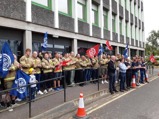 Firefighters demonstrate outside Fife House over the controversial proposals. (Pic: FFP)