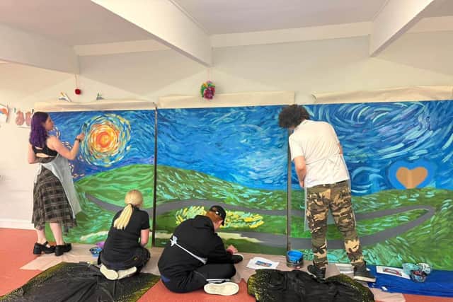 The group at work on the mural