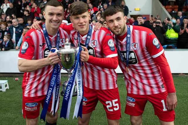 From left, Ross Matthews, Aaron Arnott and Ethon Varian celebrating winning the SPFL Trust Trophy with Raith Rovers versus Queen of the South in Airdrie in April (Photo by Paul Devlin/SNS Group)