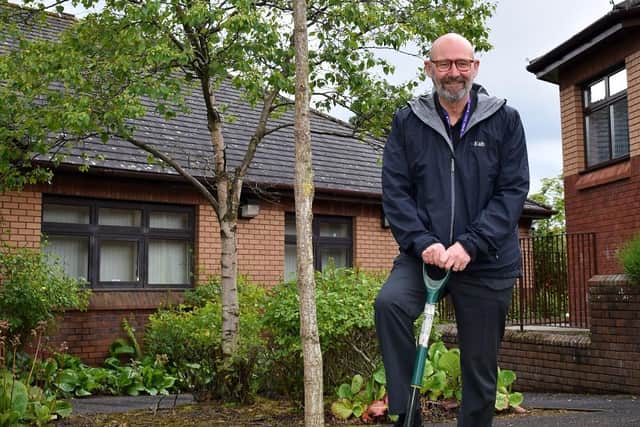 Kingdom Group chief executive, Bill Banks, with one of the newly planted oak trees at Kingdom’s Glenrothes headquarters.