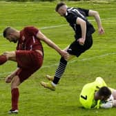Kirkcaldy & Dysart's Kieran Dall is thwarted by the Arniston keeper (Pics by Julie Russell)
