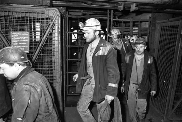 Dejection on the faces of Fife miners, leaving the cage for the last time on the day Seafield colliery closes, March 1988.