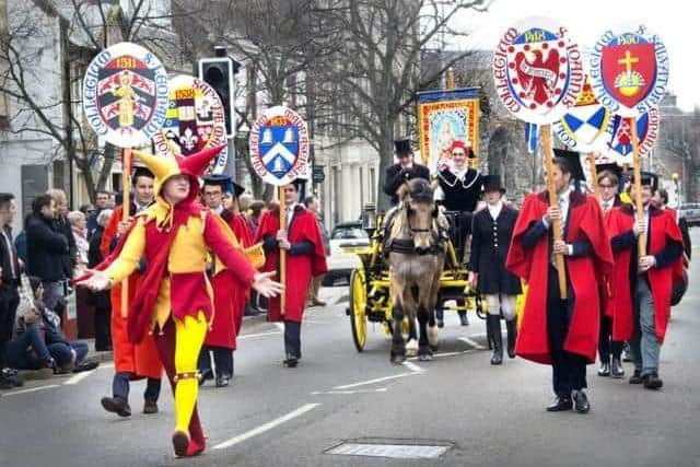 Hundreds line the streets to watch the procession