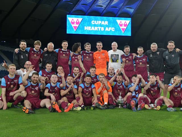 Cupar Hearts' players and coaching team celebrate on the hallowed Hampden Park turf after lifting the Scottish Amateur Cup (Pictures by Michael Gillen)