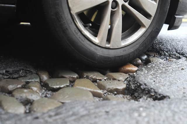 The petition calls on the council to repair potholes.
