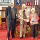Edith and Jimmy  were presented with a card and gift from the congregation by Rev. Dr. Graham Deans, Locum minister, and J Stewart Milne, session clerk.