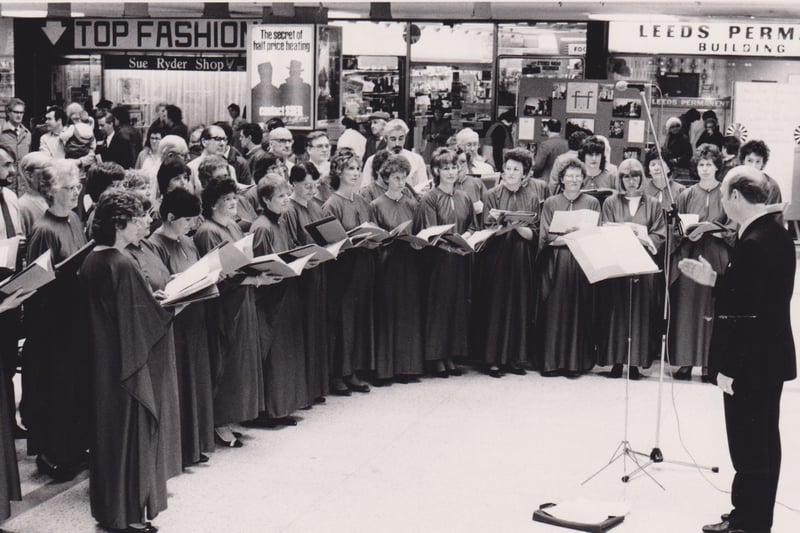 A choral society performance in the Kingdom Centre, Glenrothes, in the early 1990s. The signs on the businesses in the background show how much has changed - Top Fashion and Leeds Permanent Building Society. The picture first appeared in the Glenrothes Gazette.