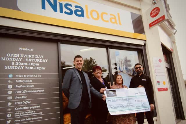 Graeme Renton of Fife Creamery presents the ‘cheque’ to Tracey Carson and Jackie Cameron of Fife Dementia Resource Centre alongside Ash Javid Store Manager of Nisa Overton Road (Pic: Submitted)