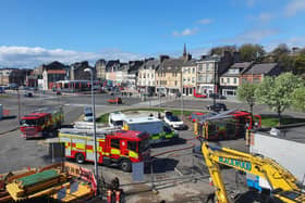 Three appliances and an ambulance were called to the old HSS Hire building on the corner near the harbour at the St James Church car park this morning.