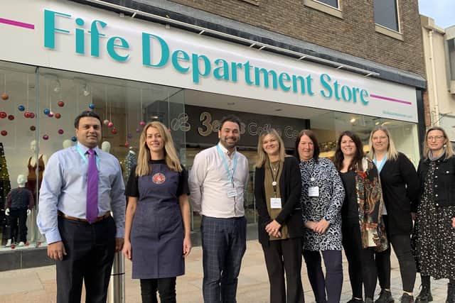 Tahir Ali, left, with staff from the new store at its launch in November 2021