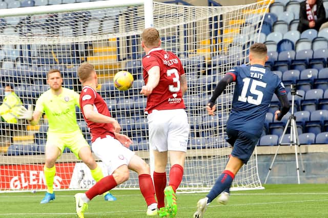 Dylan Tait beats 'keeper Derek Gaston to score an early first goal for Raith Rovers, helped partially by a deflection off Arbroath captain Tam O'Brien (picture by Fife Photo Agency)