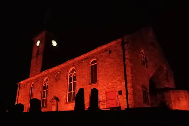Markinch Church lit up red for the poppy appeal last year