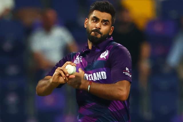 Safyaan Sharif in bowling action for Scotland versus Namibia in Abu Dhabi in the United Arab Emirates in October 2021 (Photo by Francois Nel/Getty Images)