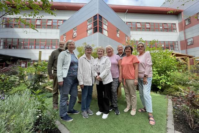 Some of the group who provide their time to care for the garden space at the Queen Margaret Hospital.  (Pic: supplied)