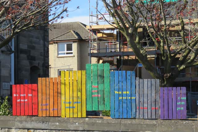 The congregation at Linktown Church have painted a rainbow on a fence in Nicol Street.