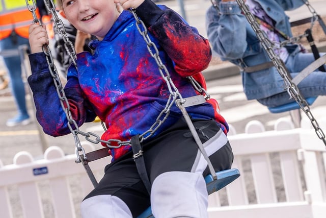 Pictured is Mason Cowen on one of the fairground rides.