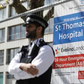 Police officers stand in front of barriers erected outside St Thomas' Hospital in London (Photo: TOLGA AKMEN/AFP via Getty Images)