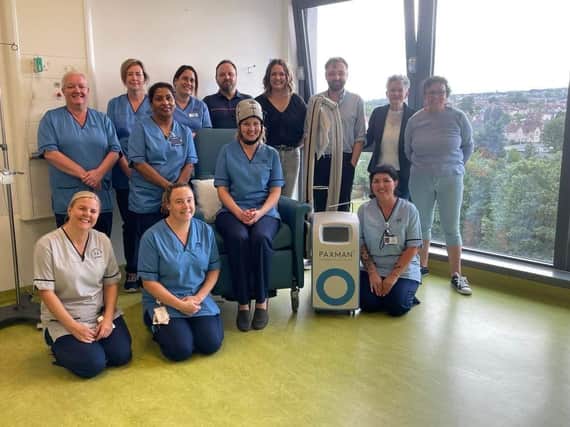 The new scalp-cooling system has been donated to Victoria Hospital's haematology/oncology day unit. Pictured are Lesley-Anne Chessor, close family of Hanniffia McGrath and nursing staff.  (Pic: NHS Fife)