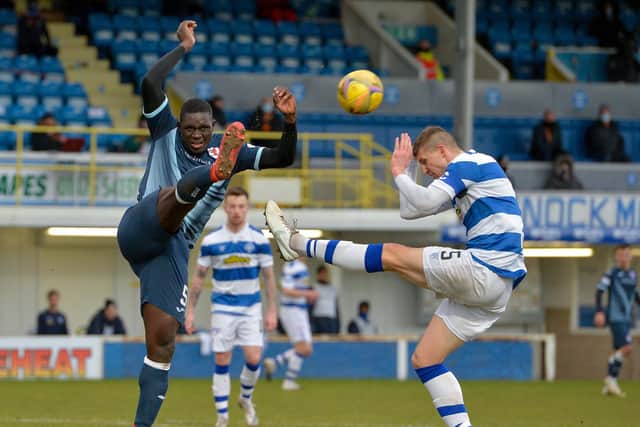 Fernandy Mendy tussles with Morton's Sean McGinty (Pic: Dave Johnston)
