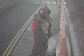 CCTV shows four individuals placing banners and posters on David Torrance MSP's office