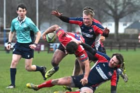 Fraser Allan breaking through tackles to score Howe of Fife’s third try during their 35-14 win hosting Newton Stewart at Cupar’s Duffus Park in December 2025 (Photo: Chris Reekie)