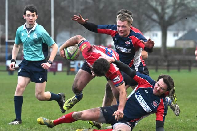 Fraser Allan breaking through tackles to score Howe of Fife’s third try during their 35-14 win hosting Newton Stewart at Cupar’s Duffus Park in December 2025 (Photo: Chris Reekie)
