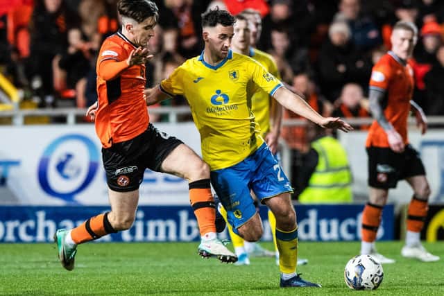 Dundee United's Chris Mochrie and Raith Rovers' Shaun Byrne in action at Tannadice Park on Saturday (Photo by Sammy Turner/SNS Group)