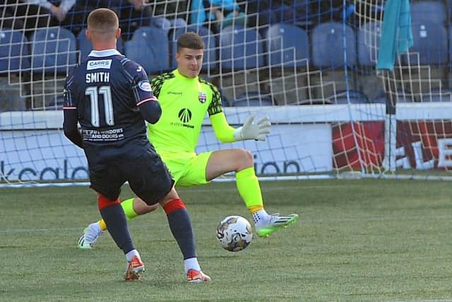 Callum Smith nutmegging goalkeeper Ross Matthews during Raith Rovers' 3-1 SPFL Trust trophy fourth-round win at home to Montrose on Saturday (Pic: Fife Photo Agency)