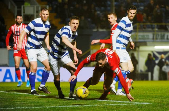 Jamie Gullan battles for the ball against Morton. (Pic: Alan Murray)